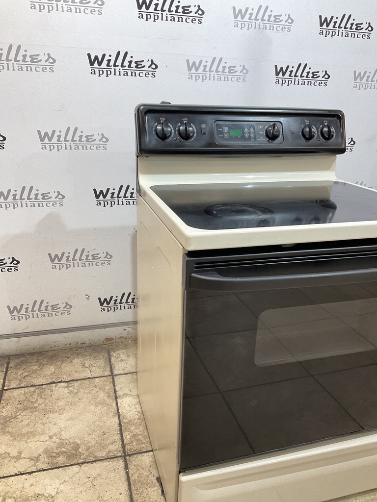 Ge Used Electric Stove 220volts (40/50 AMP) 30inches {3 prong} (Bisque/black) 